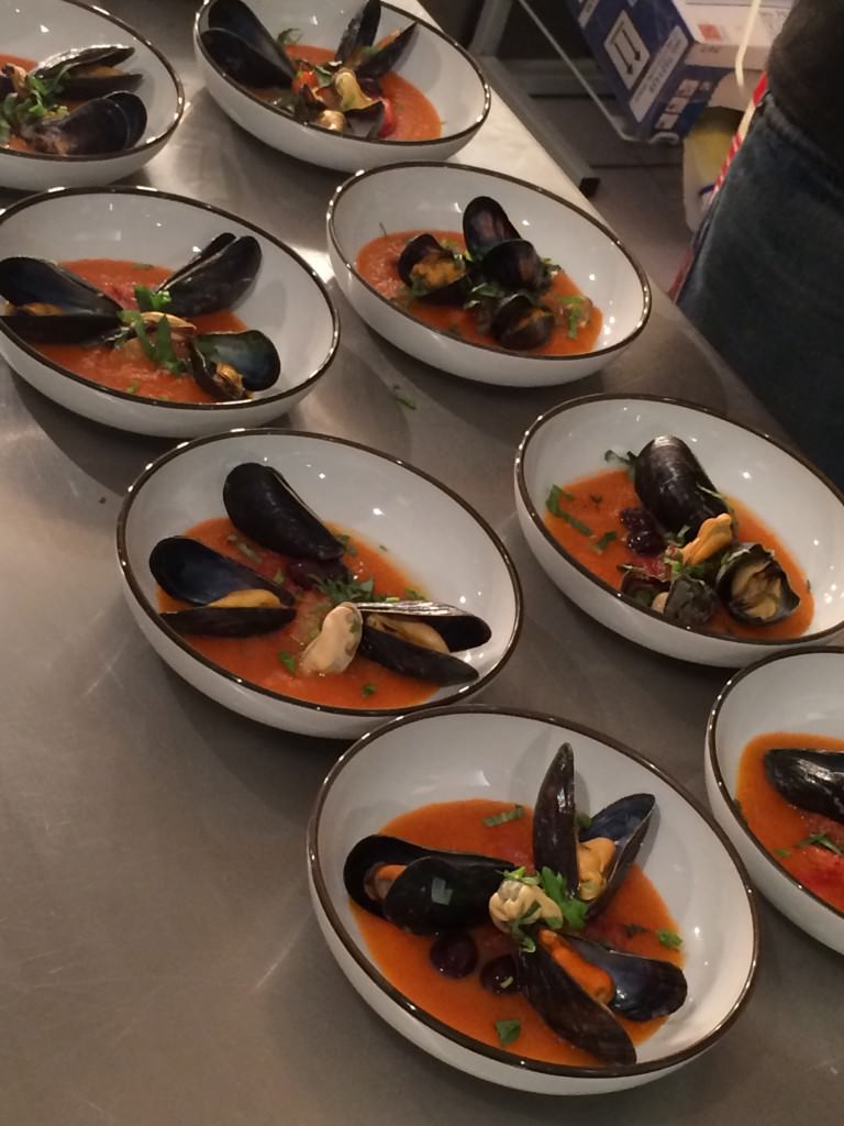 Mussels with tomato coulis, olives and orange